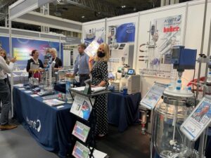 Dr Kerry Elgie strikes a pose in the Asynt, Huber UK, and Vacuubrand booth at CHEMUK 2021
