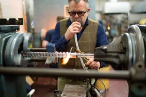 Martyn Fordham in the glassblowing workshop, making an Asynt CondenSyn waterless air condenser